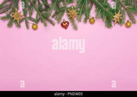 gold and pink christmas decorations and pink ribbon on a fabric christmas tree ornament